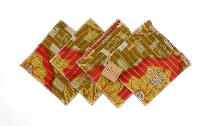Set of 4 coasters 18x18 cm in patchwork with red, yellow-green and beige colors, decorative floral motifs and white edge stitching