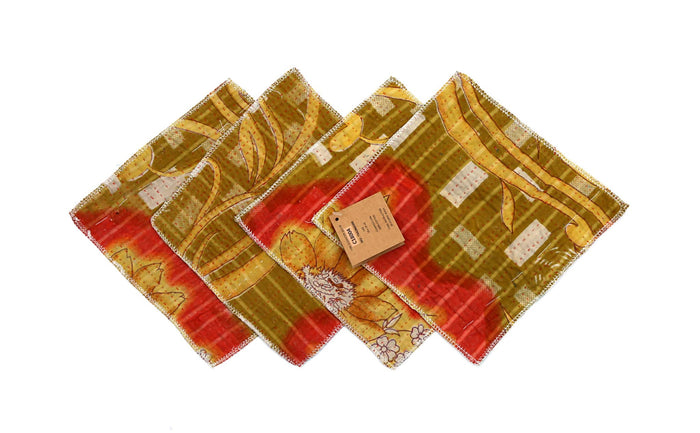 Set of 4 coasters 18x18 cm in green, yellow and red with decorative floral motif and lightly embossed, quilted edges